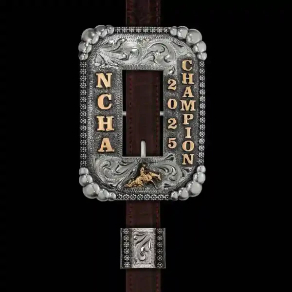 Our Red Dun Headstall Buckle showcases a traditional headstall style. Handcrafted on a German Silver base, it features a classic berry and five-bead edge, Jeweler's Bronze figure and custom lettering. To complete this design, we've added our signature ant